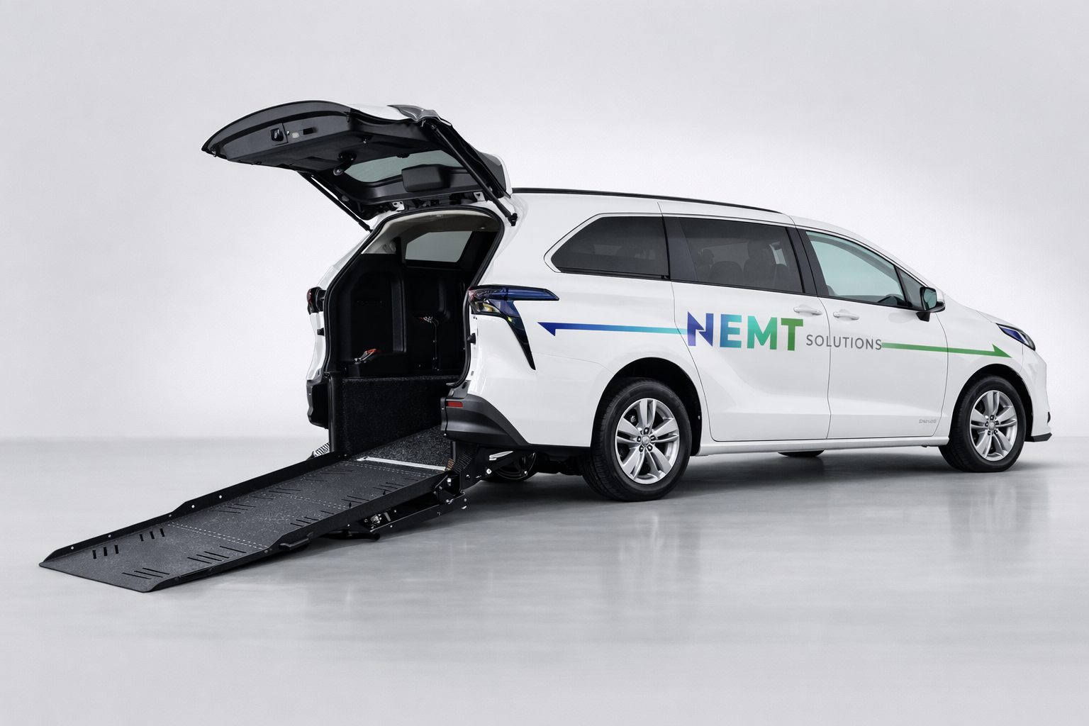 NEMT Solutions accessible vehicle with its wheelchair ramp open.